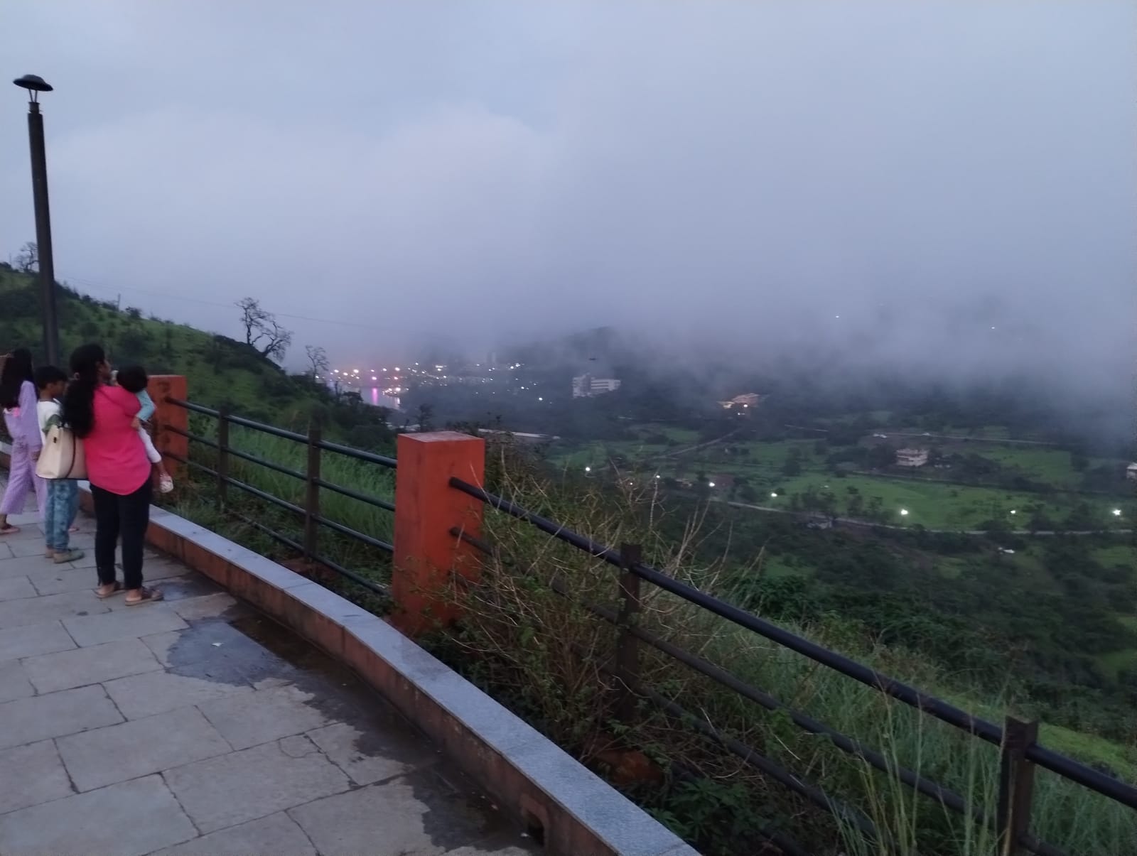 Sunset Point, Saputara. The clouds came down to meet us and the town lights showed through the gaps.